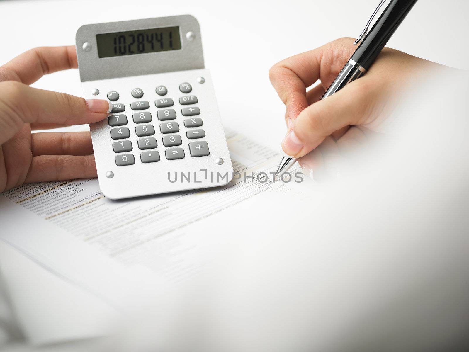 Market Analyze - pen and calculator on papers