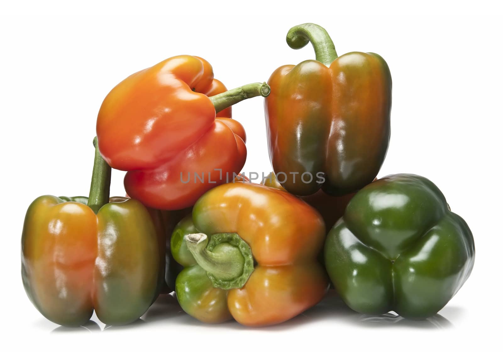 Red and green peppers isolated over a white background.