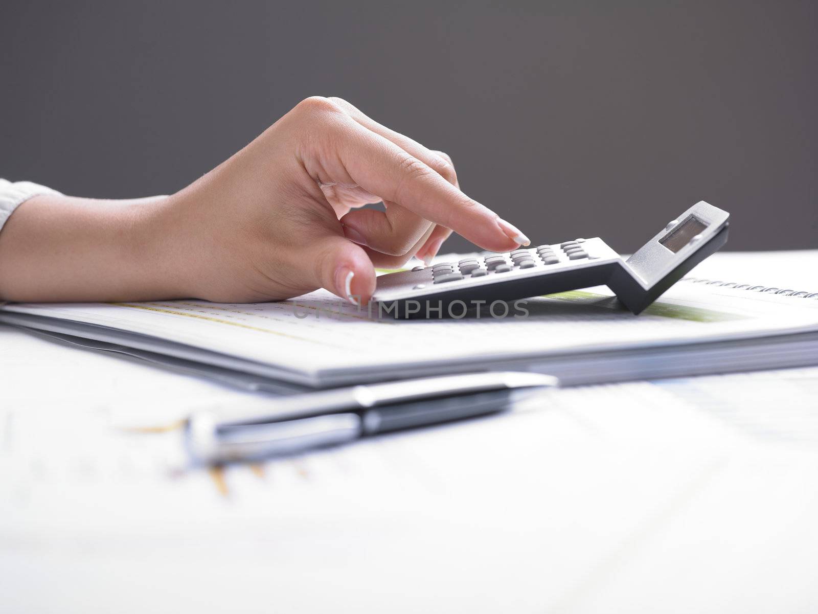 Market Analyze - pen and calculator on papers