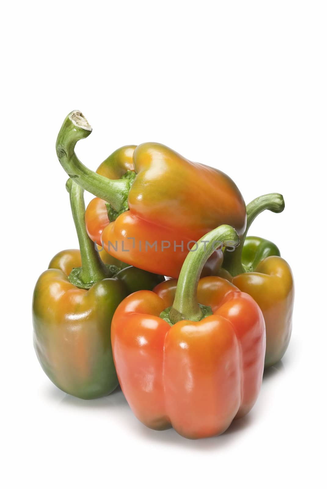 Red and green peppers isolated over a white background.