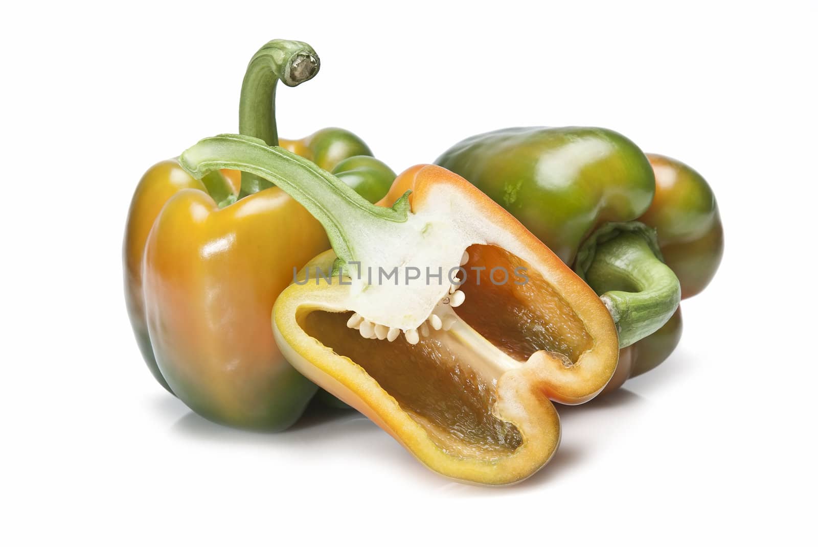 Red and green peppers isolated over a white background.