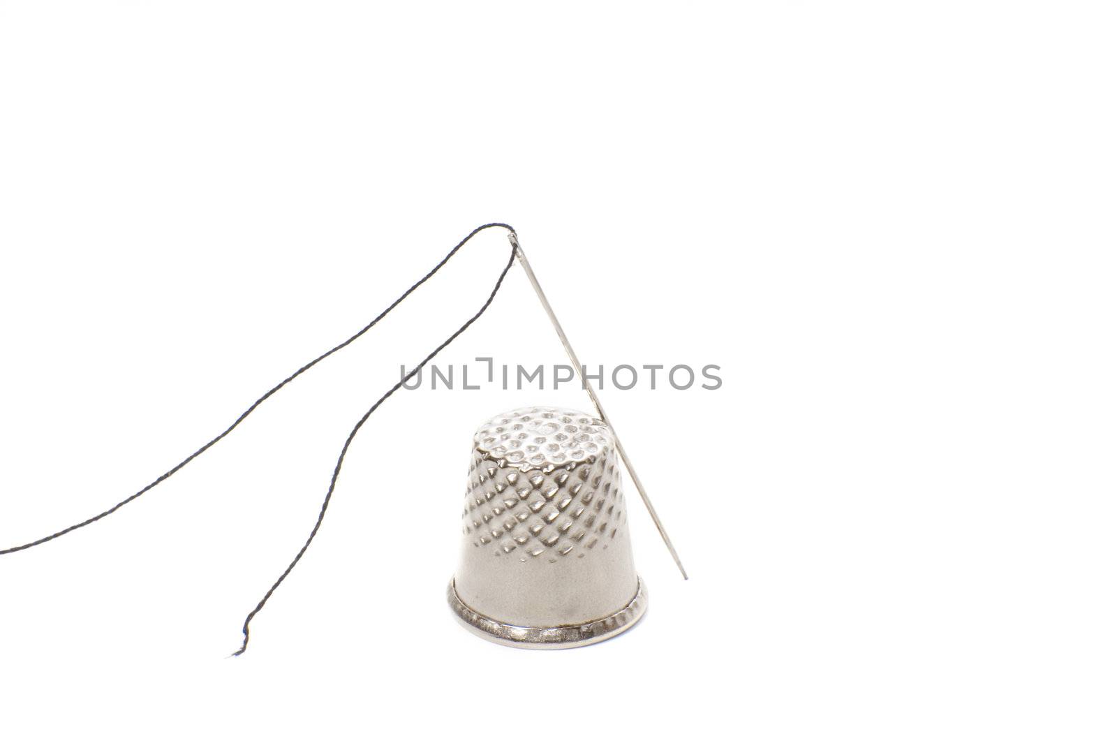 needle and thimble isolated  by Carche