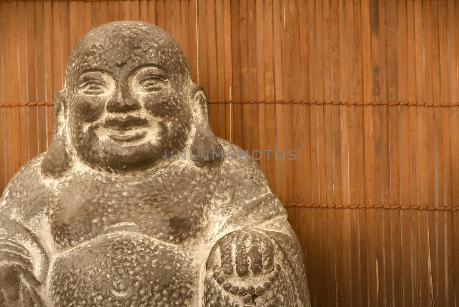 Buddha figure on a background of bamboo 