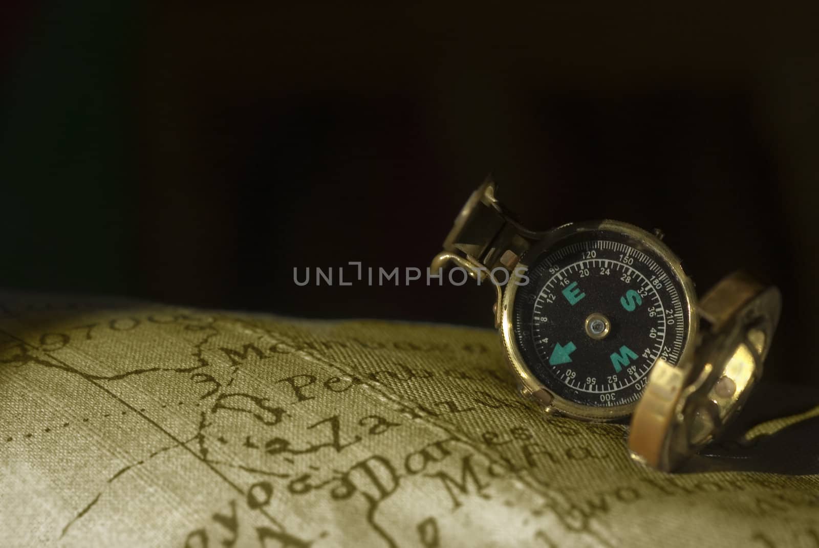 Old compass on an old map and space for text 