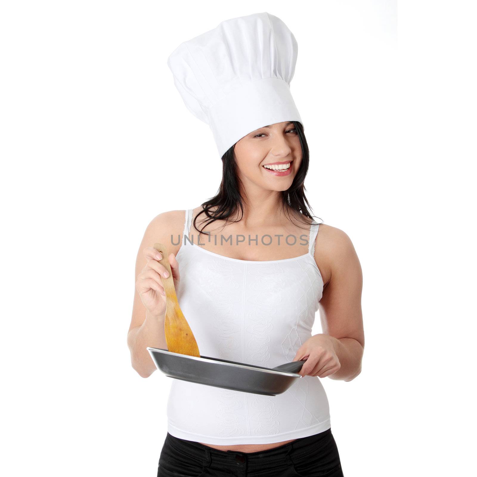 Young woman cooking healthy food by BDS