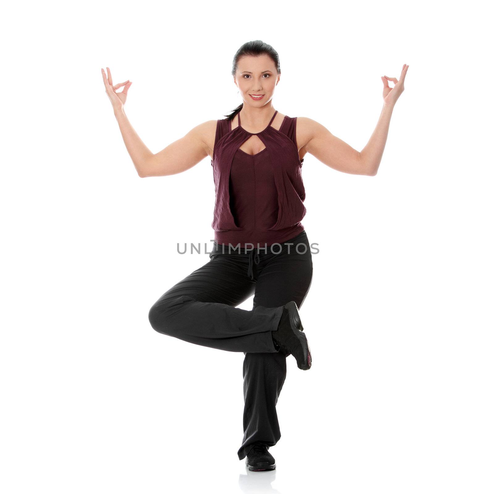 Young woman doing exercise, isolated on white