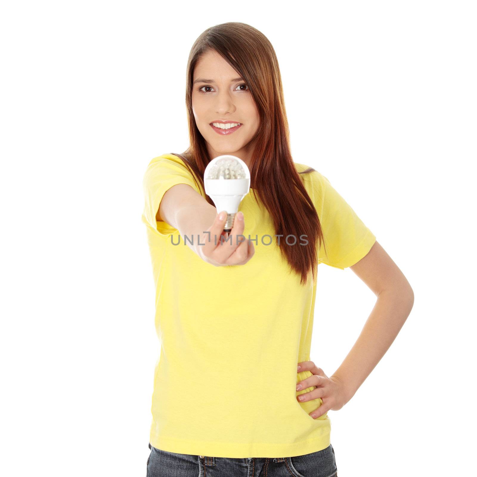 Young happy woman holding diode bulb, isolated on white