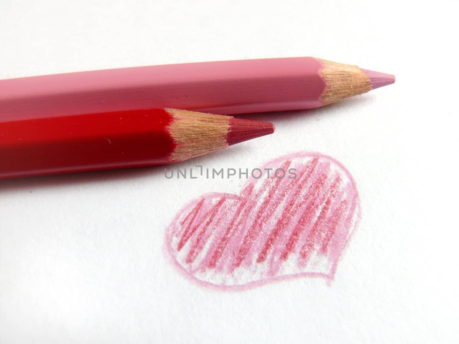 Heart painted by red and rose pencils