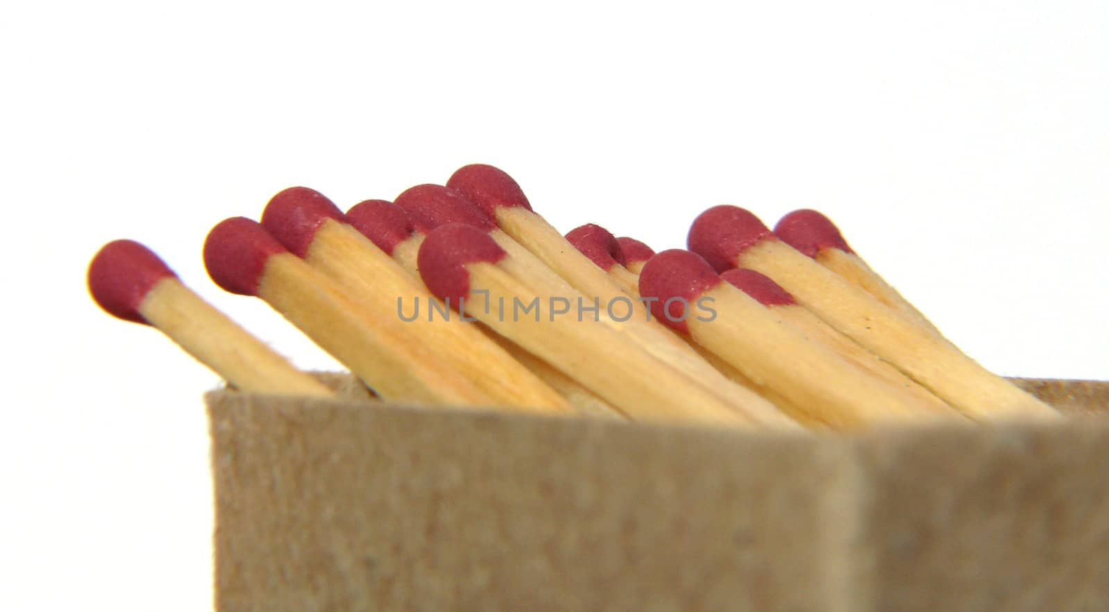 Matches in box. Extreme close-up on white background.