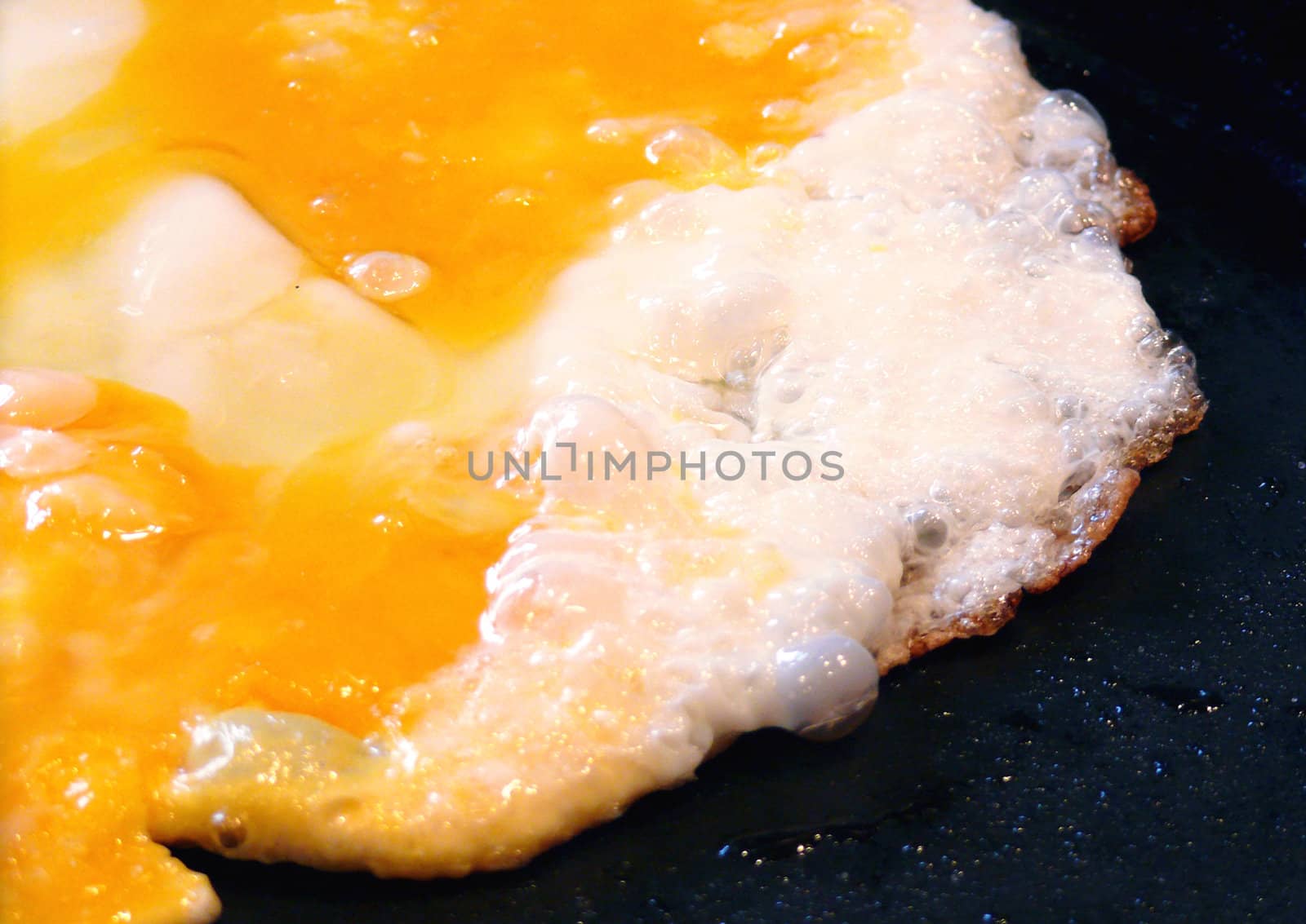 Fried eggs on the frying pan