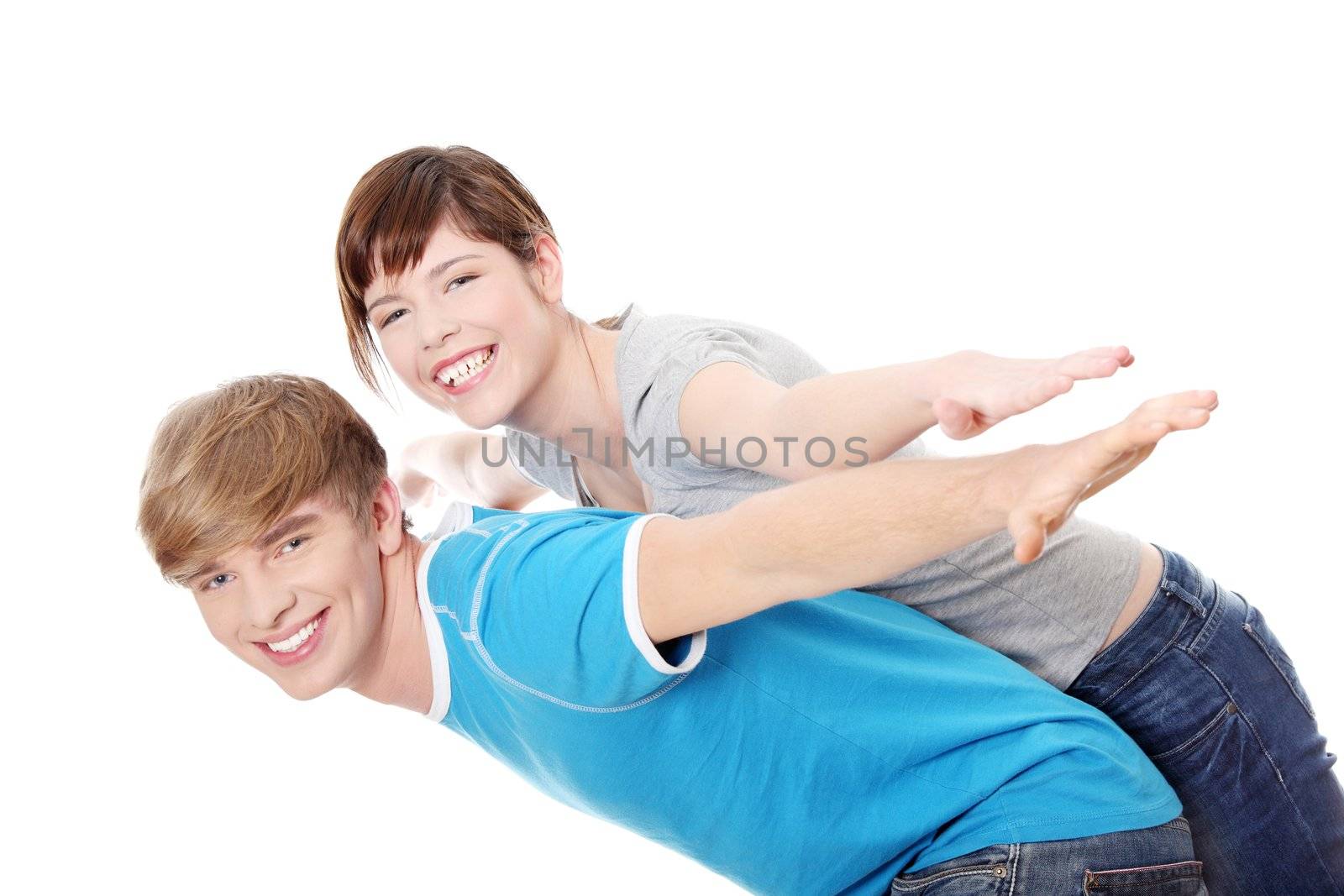 Happy two young people gesturing flying. Isolated on white background.