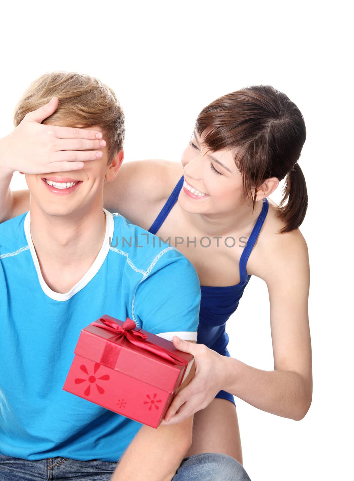 Girl give a gift to her boyfriend. Isolated on white background.