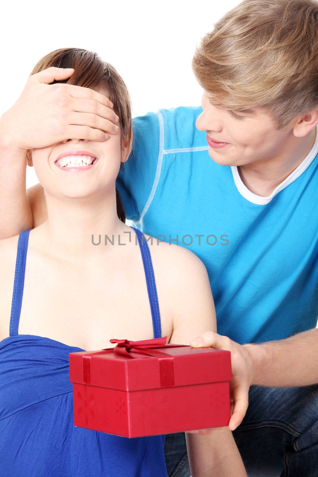 Boy give a gift to his girlfriend. Isolated on white background.