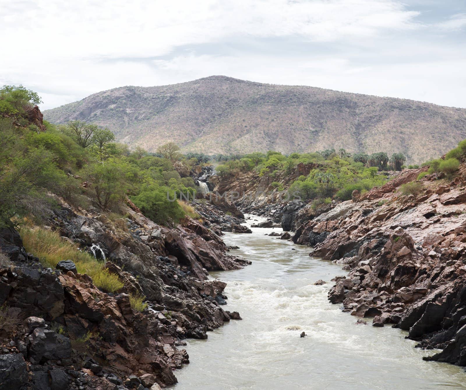 The Epupa Falls lie on the Kunene River, on the border of Angola and Namibia