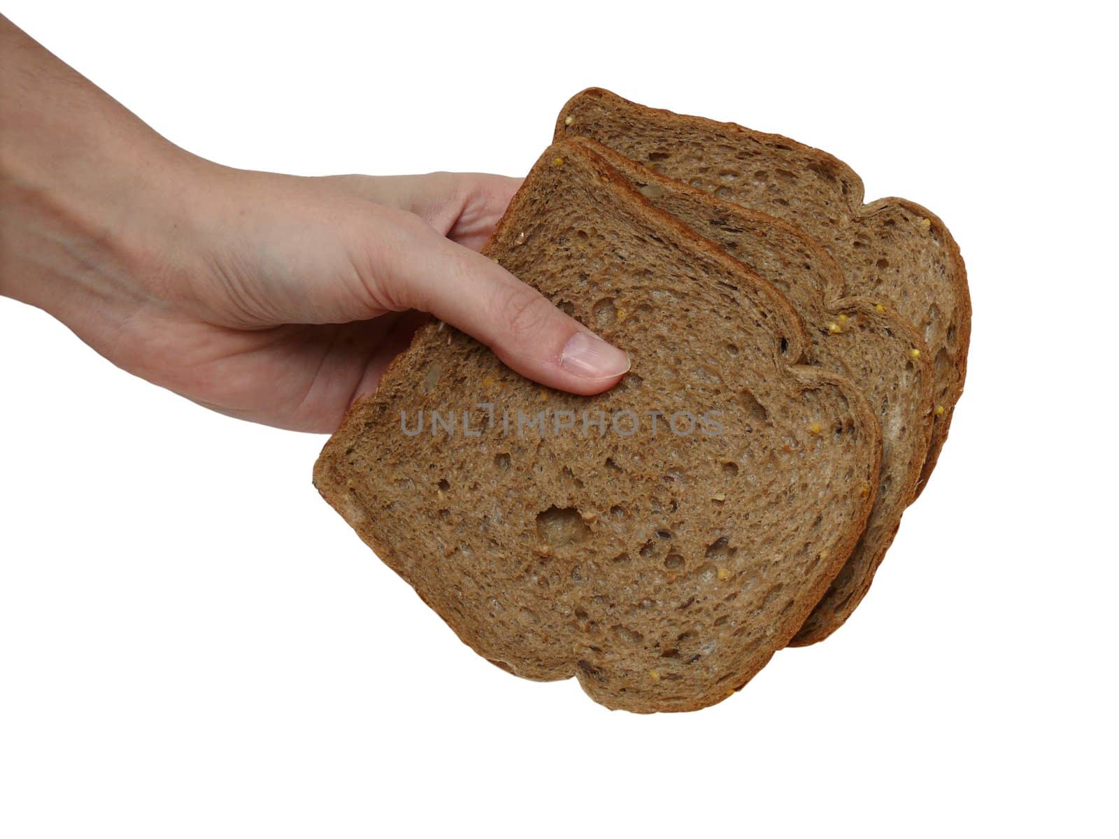 Hand holding three slices of cereal bread