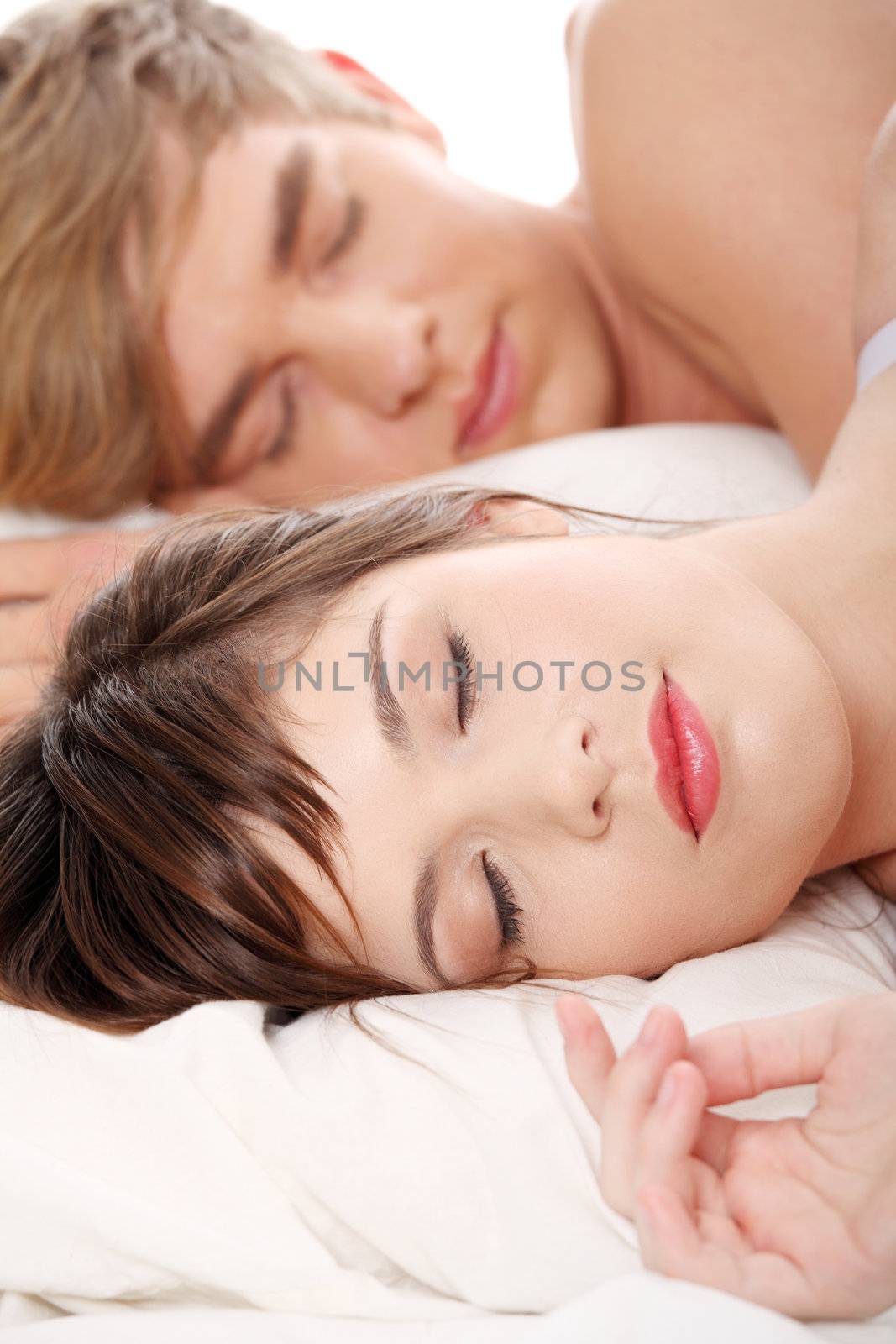 Young couple sleeping in bed. by BDS