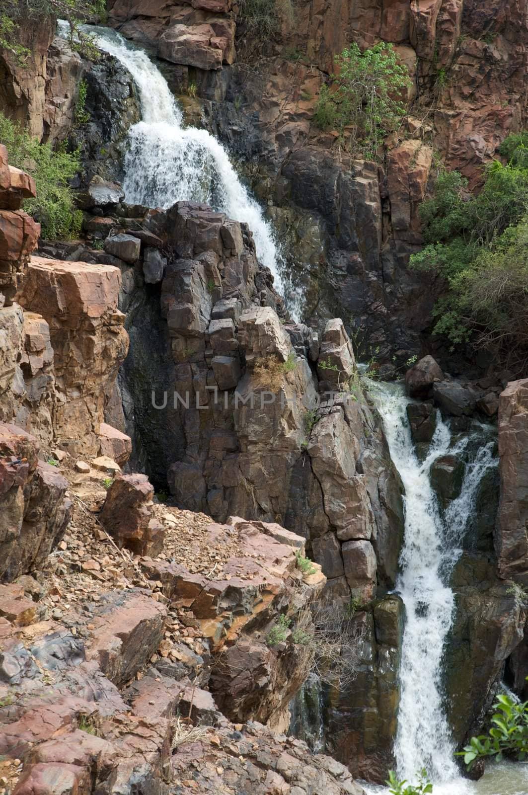 The Epupa Falls lie on the Kunene River, on the border of Angola and Namibia