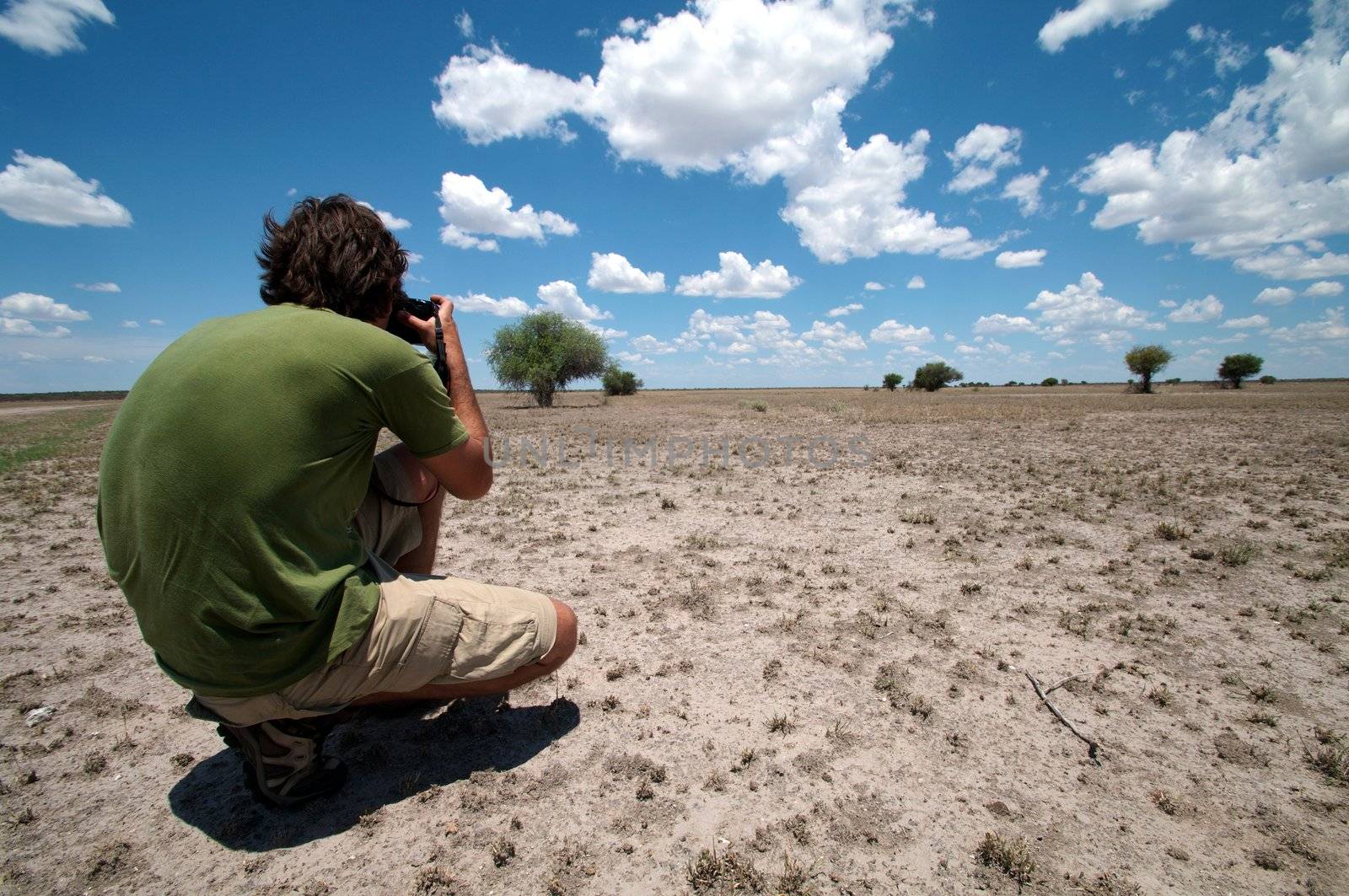 Photographer taking outdoor photos in the desert of Botswana