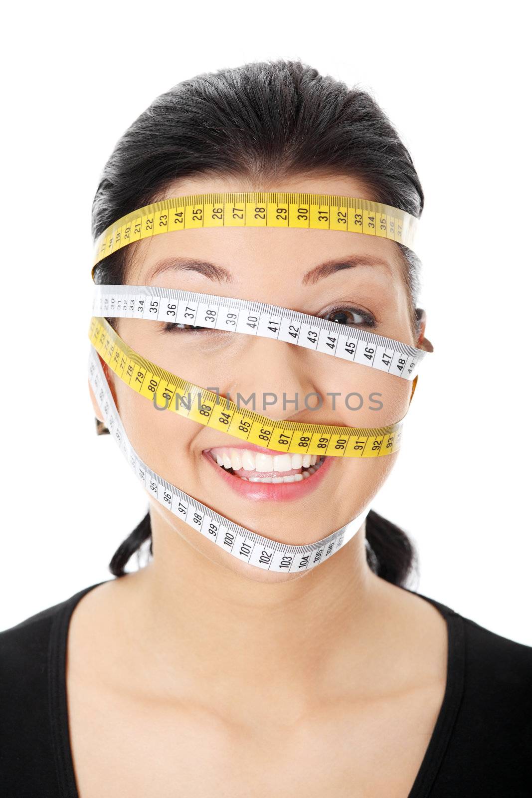 Beautiful young caucasian woman with measuring tape around her head, isolated on white. Diet concept