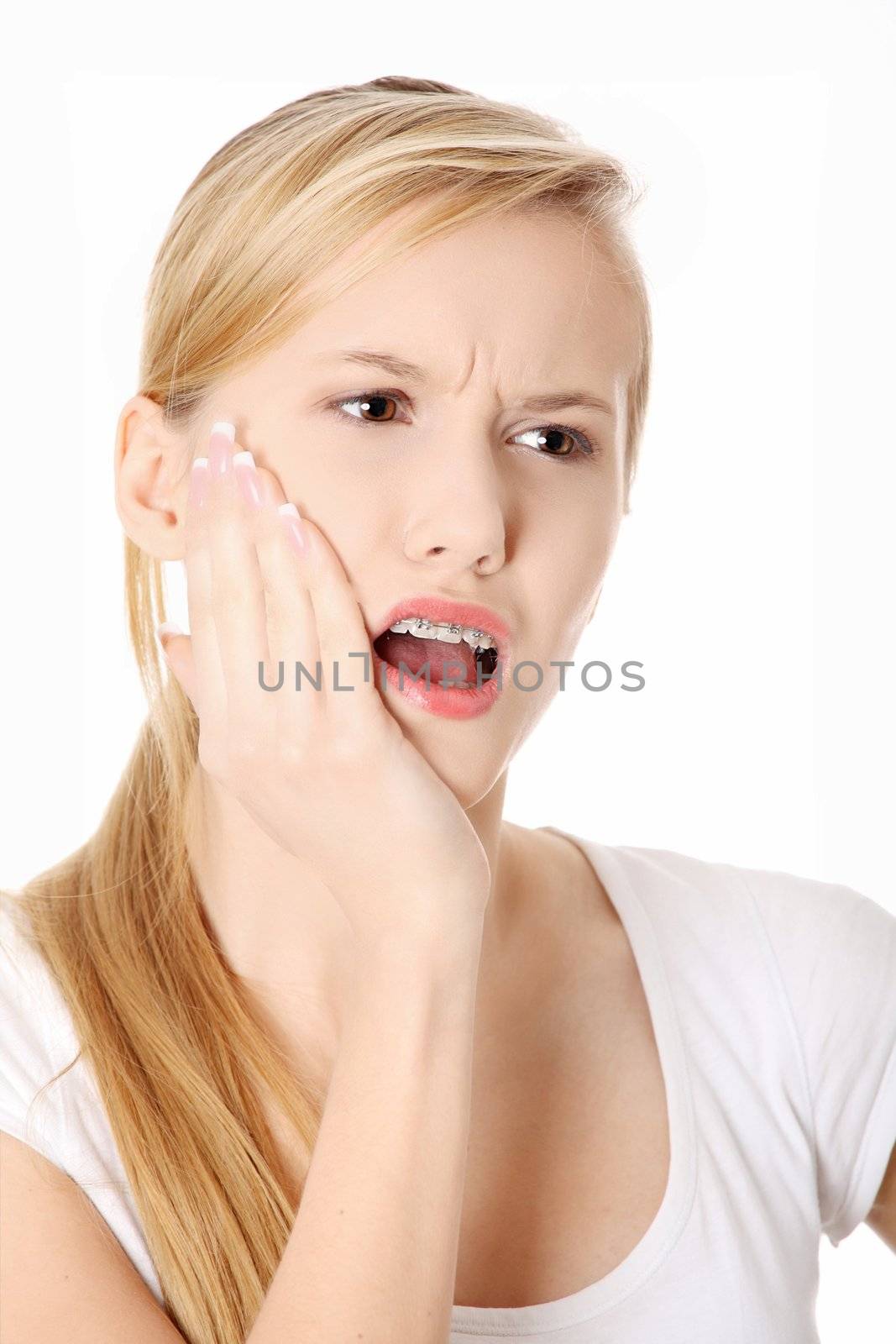 Young woman is having toothache by BDS