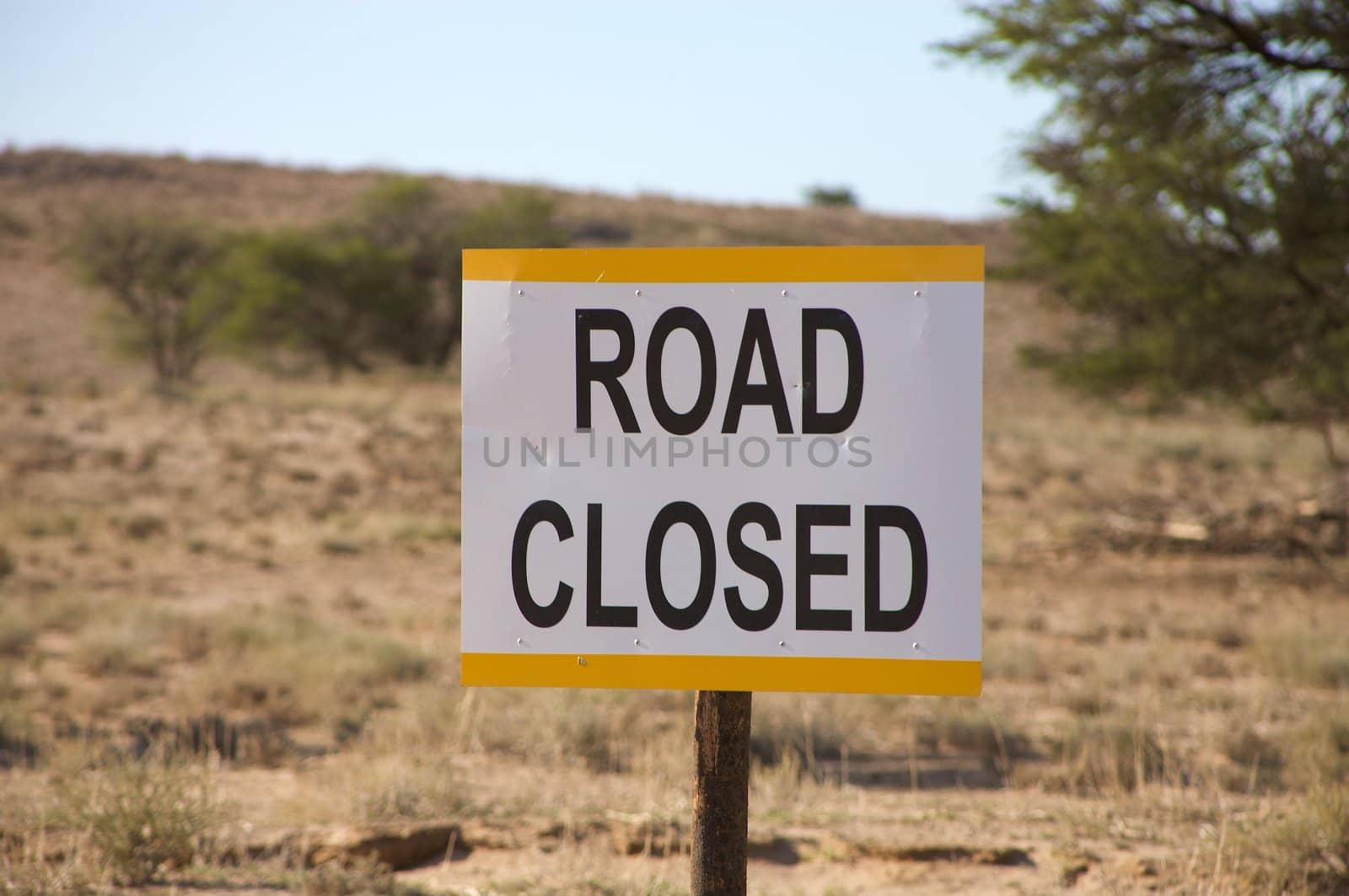 Road closed signboard in the Kalahari desert by watchtheworld