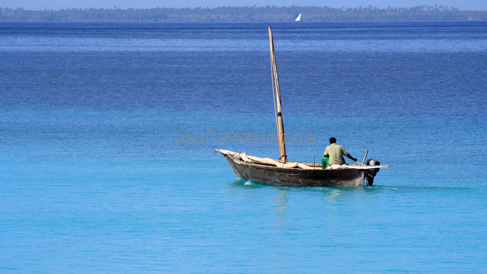 A fisherman on a quiet sunny day