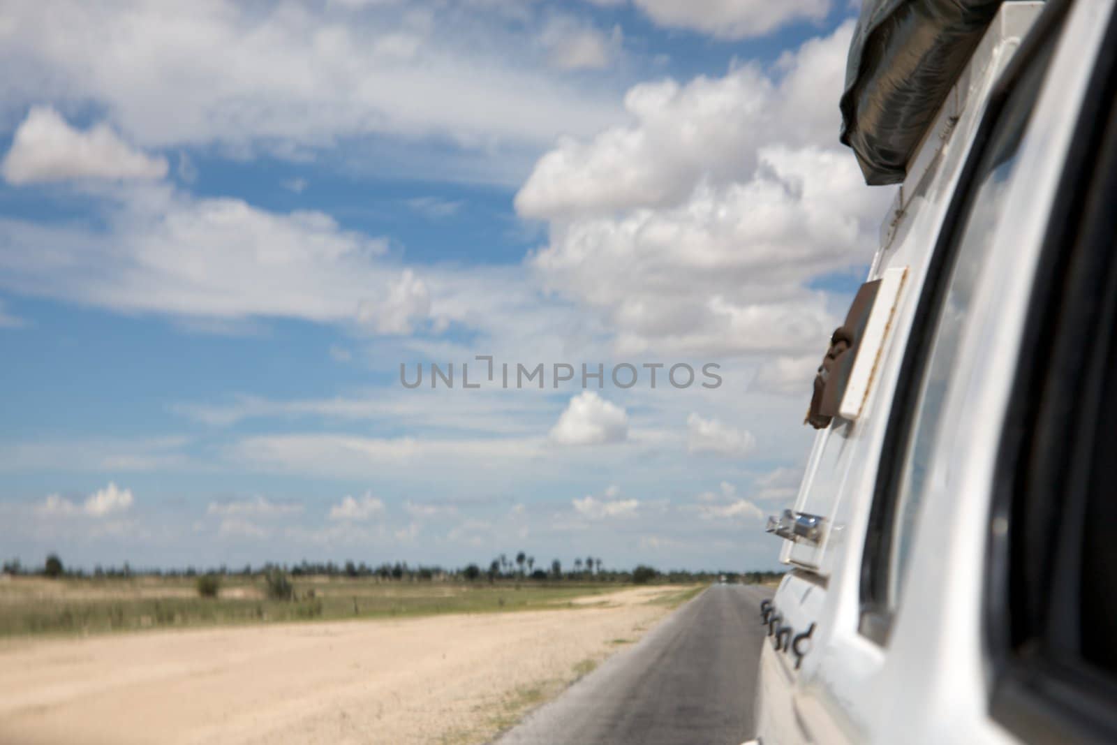 Rear view from the car driving in the north of Namibia