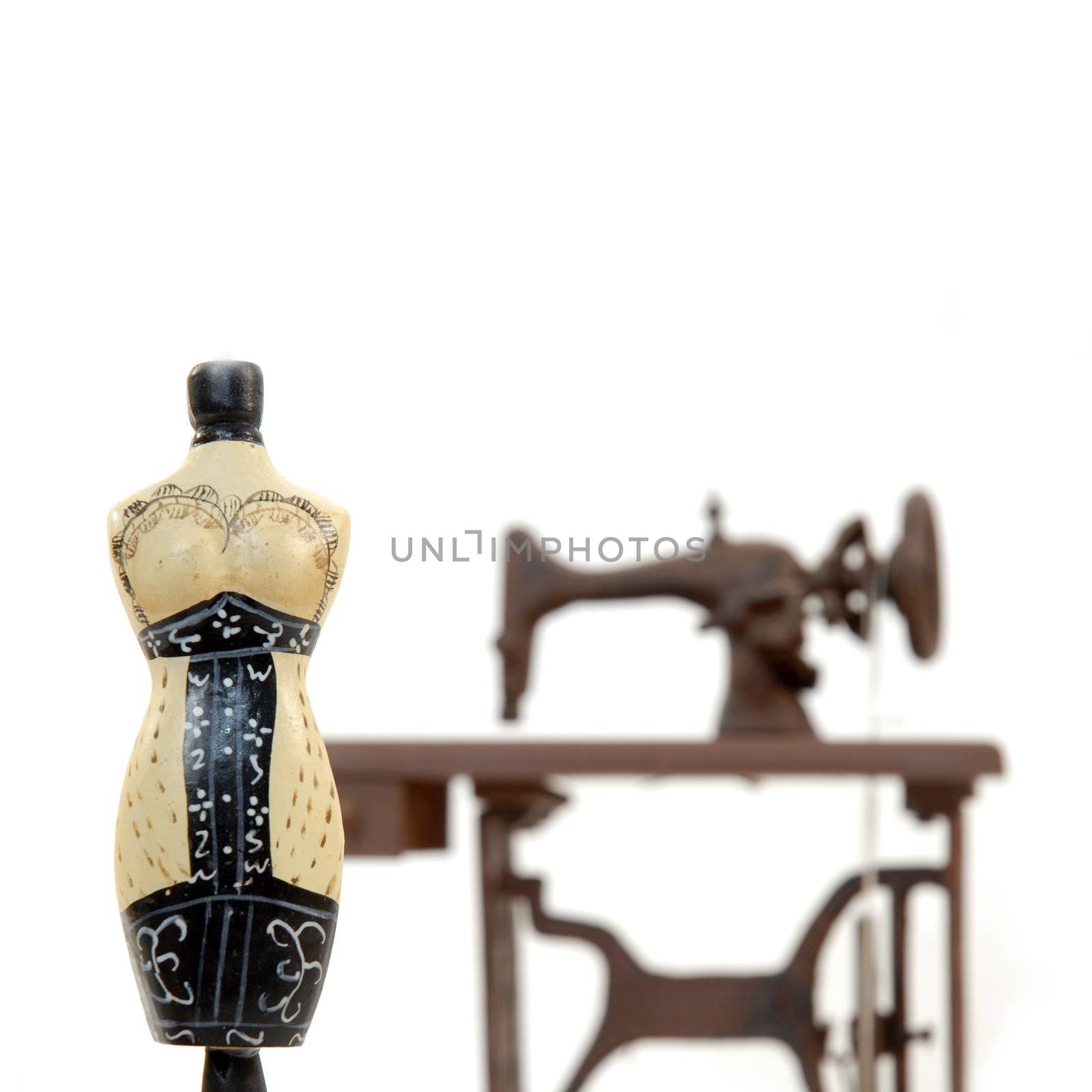 female mannequin and sewing machine isolated on white background