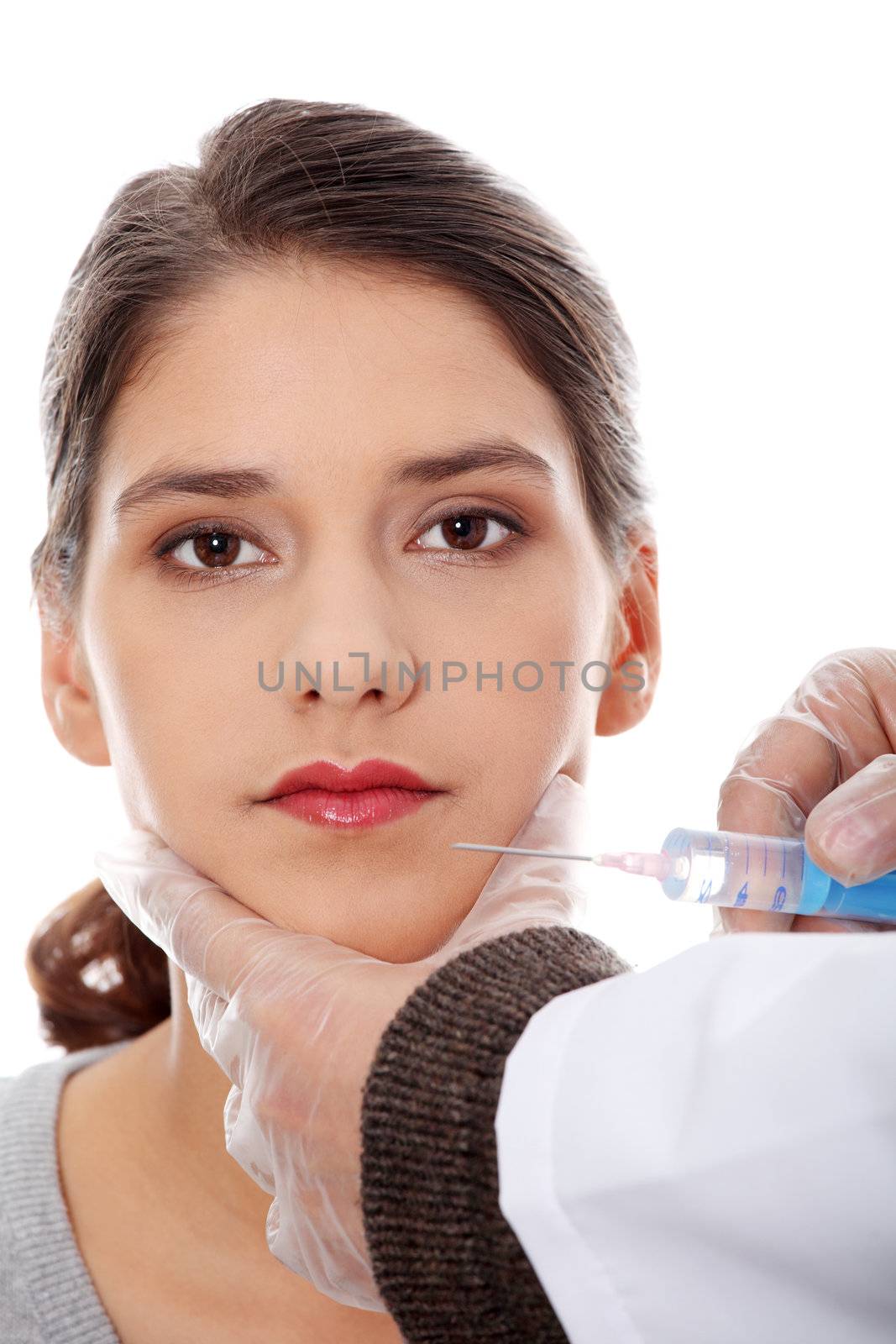Plastic surgeons giving botox injection by BDS