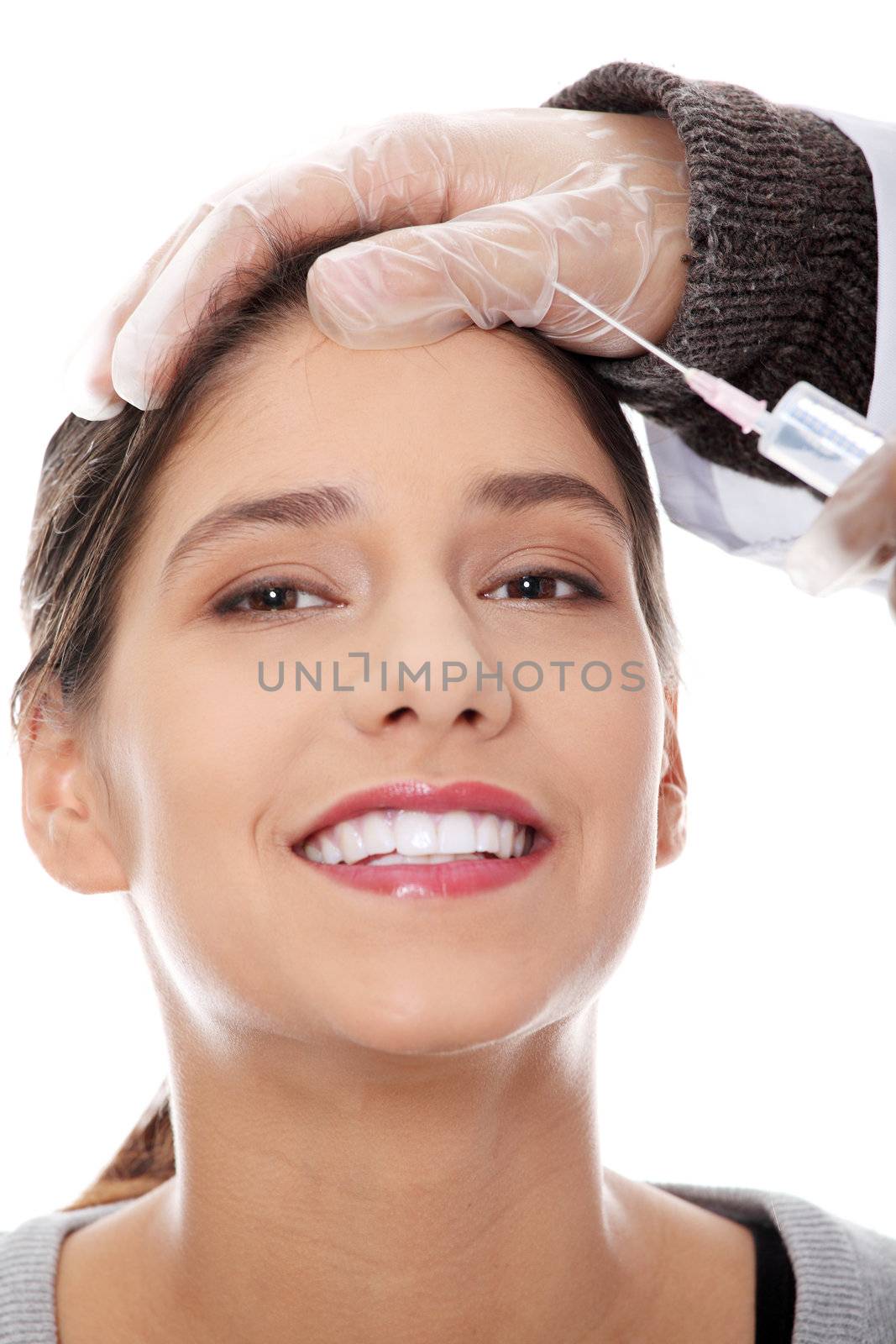 Plastic surgeons giving botox injection in female skin. Isolated on white