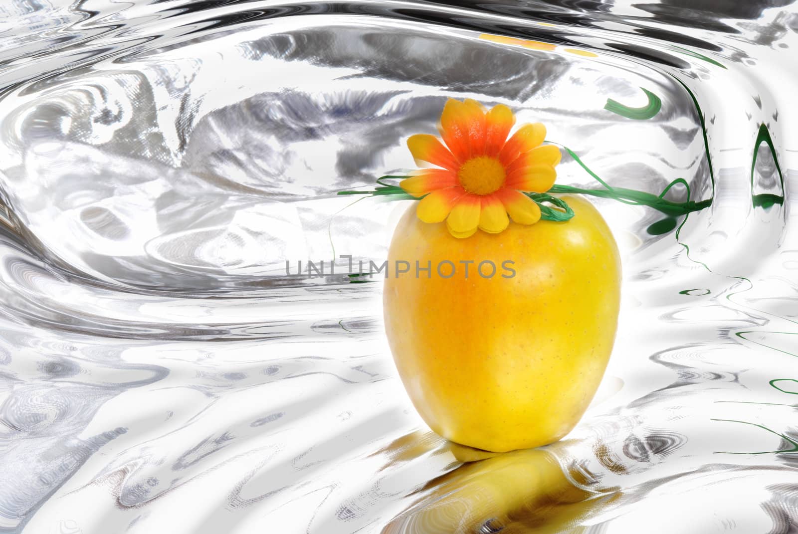 apple with a flower in a water background 