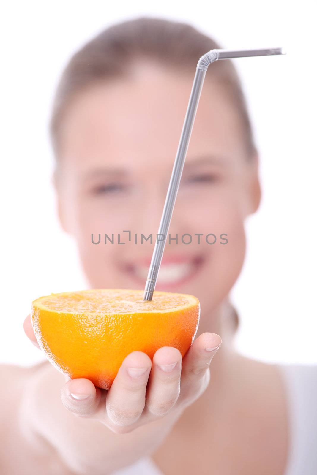 Young caucasian woman with orange, isolated on white background