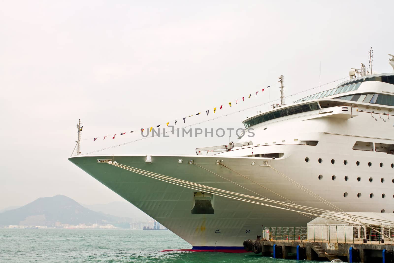 A great ship parked in the harbor of Hongkong, in a foggy morning
