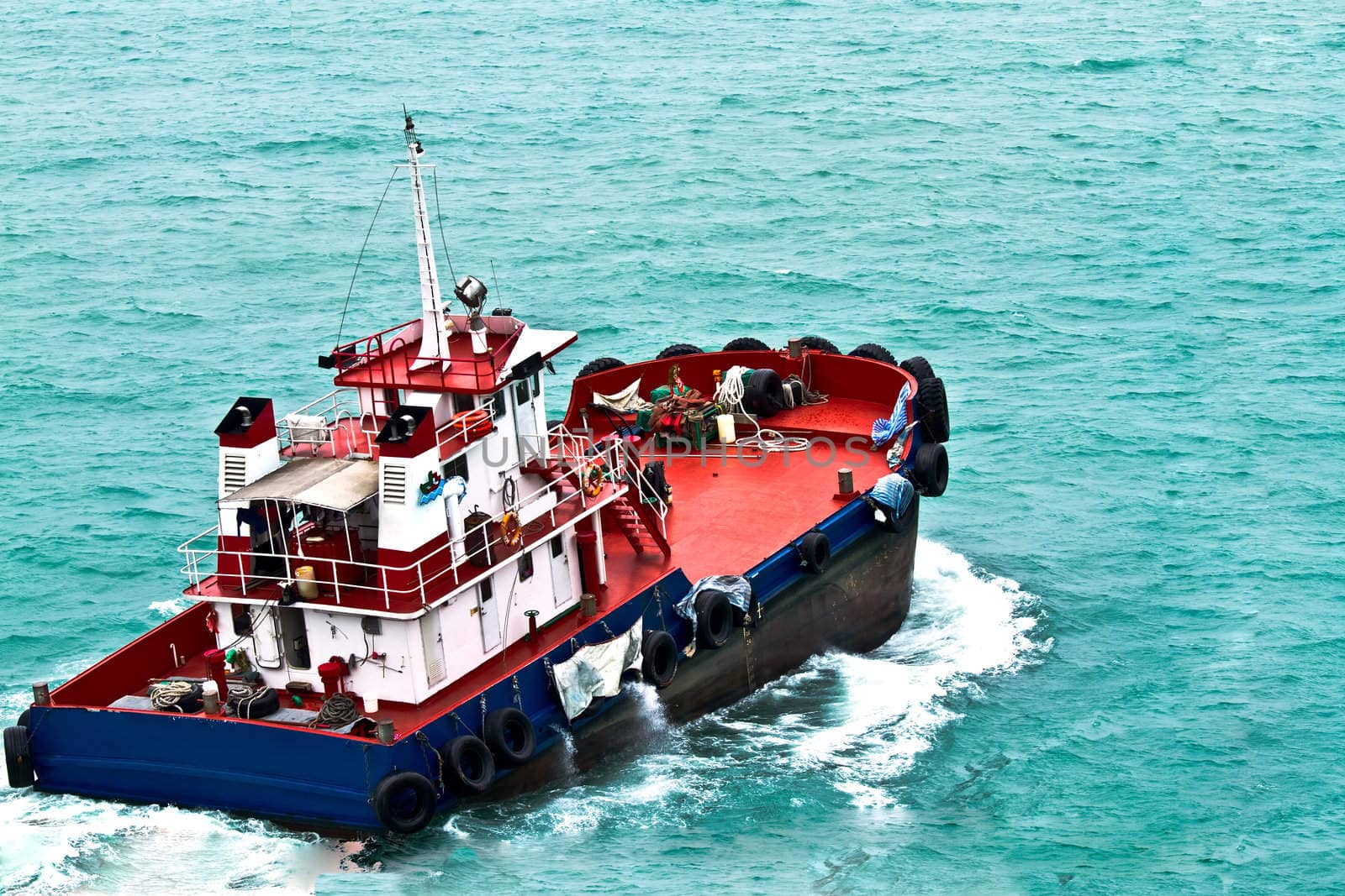 A ferry boat is carrying people to the places of interest on the sea