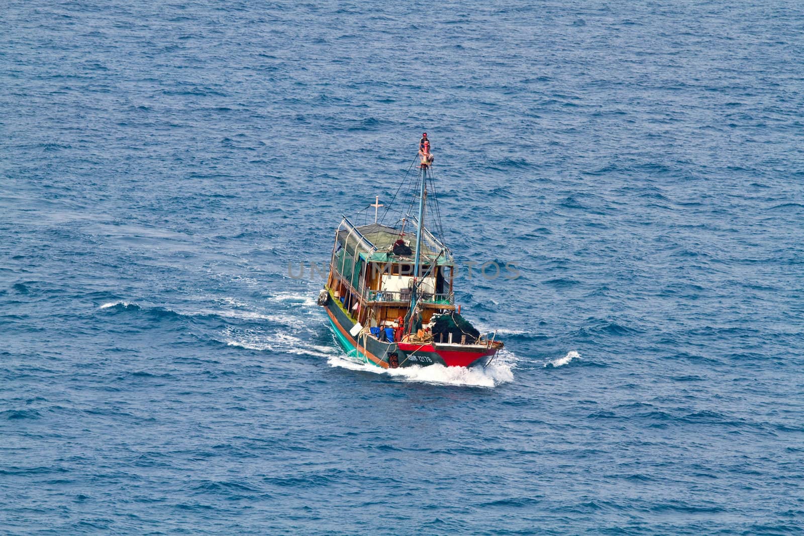 A ferry boat is carrying people to the places of interest on the sea