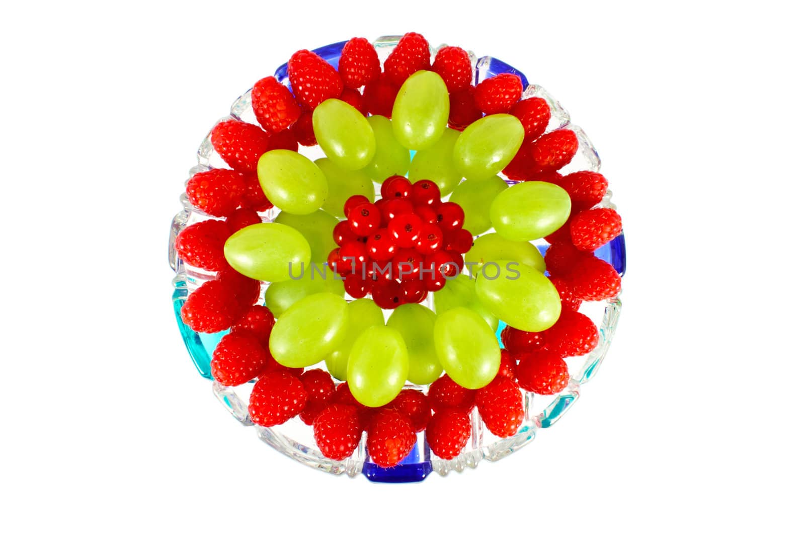 Mix of fruit on glass plate isolated on white