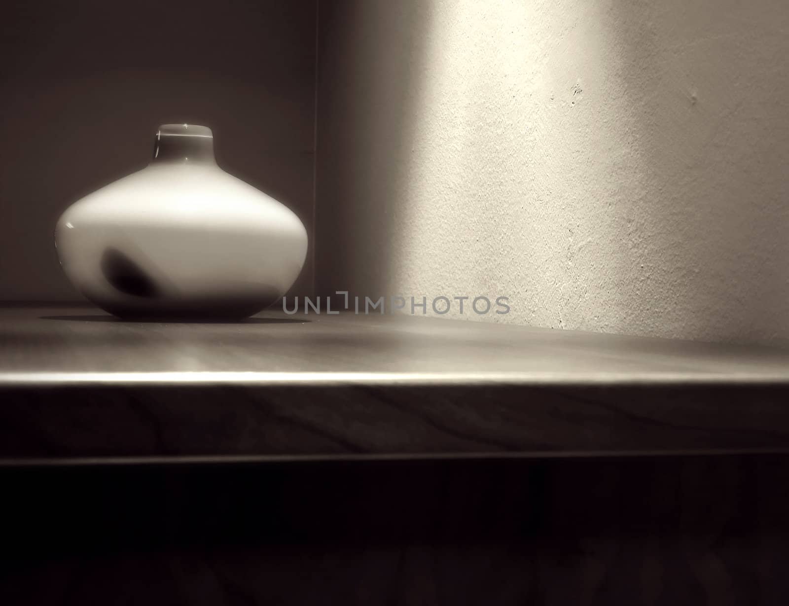 Vase on the wooden table in modern interior - Soft focus black and white toned  photo