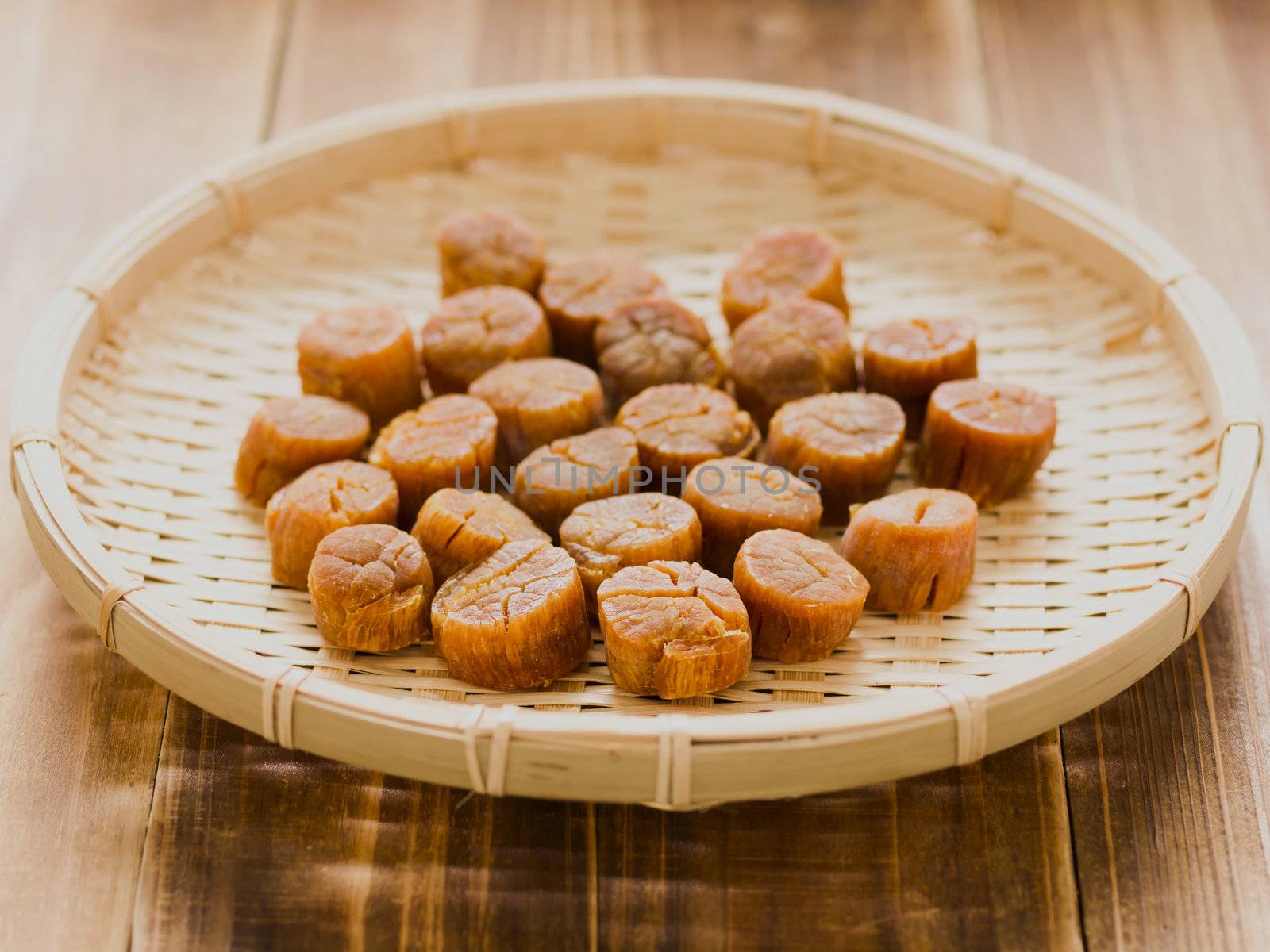 close up of a basket of dried scallops