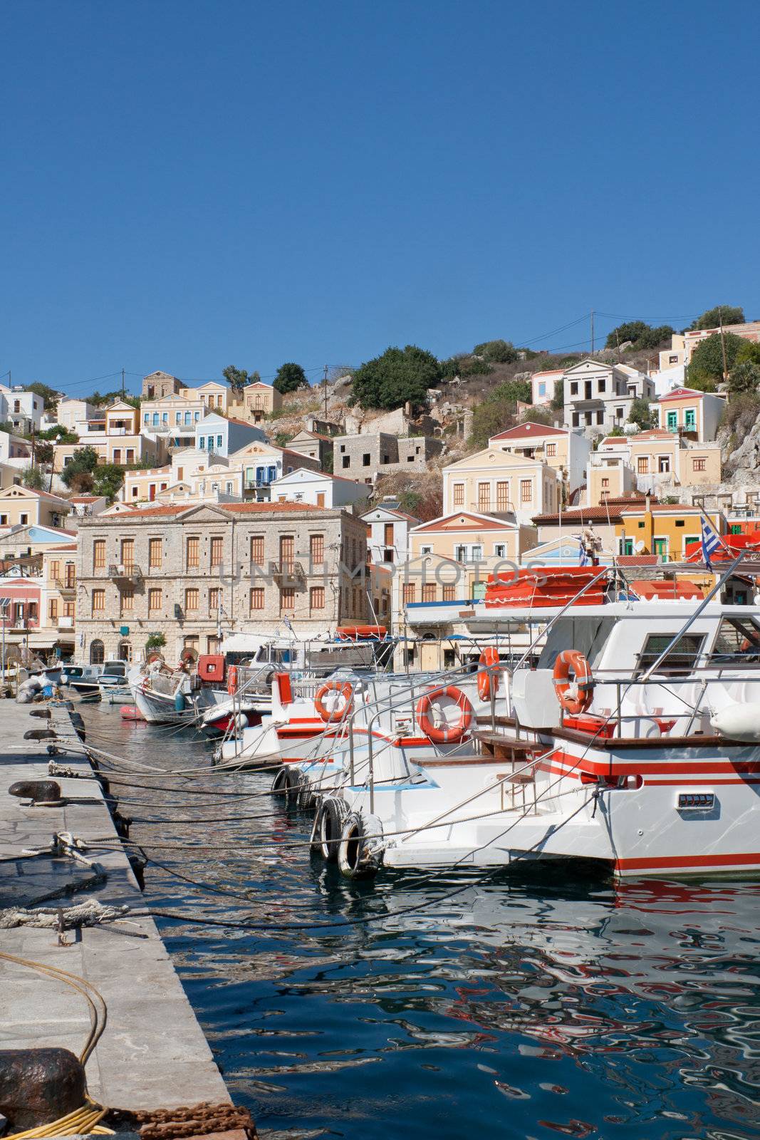 Partial view of Gialos, the harbour of the island of Symi in the Dodecanese, southeast of Aegean Sea, Greece.