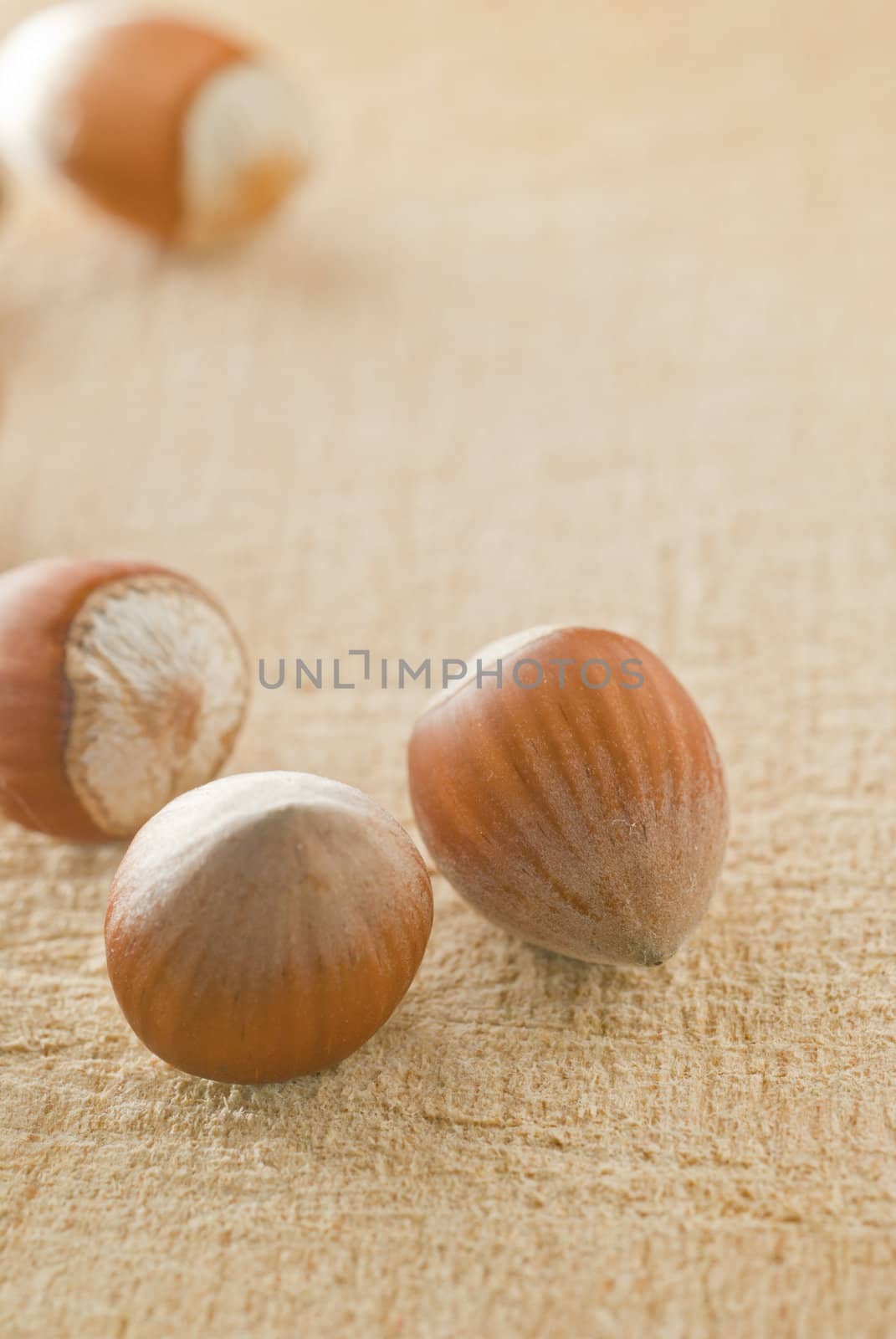 Hazelnuts on wooden plate