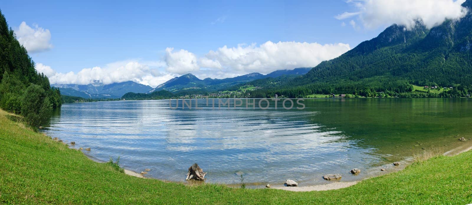 Panorama a blue transparent alpine lake. Salzkammergut. Austria