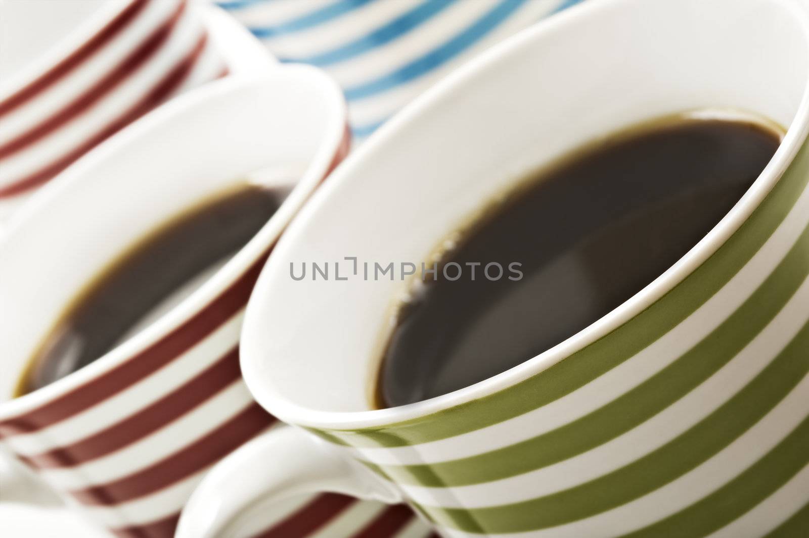 Close ups of mugs of black coffee by tish1