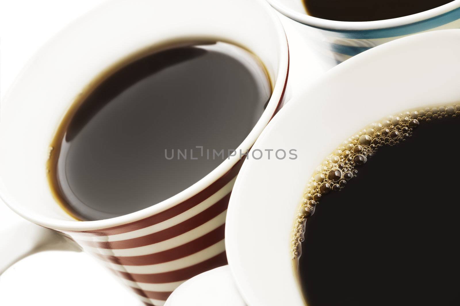 Close ups of mugs of black coffee by tish1