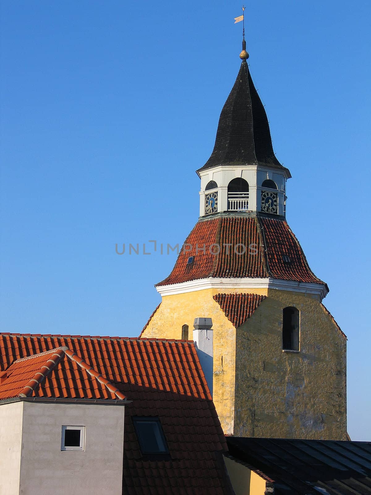 Classical old style bell tower landmark of the old city Faaborg Denmark vertical image