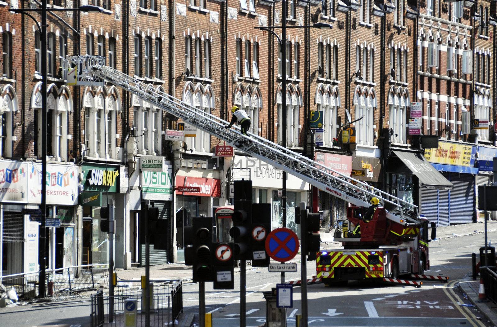 LONDON - AUGUST 09: Clapham Junction area is sacked after the third night of riots, on August 09, 2011 in London. Riots start spreading in London after Mark Duggan was shot dead by the police.