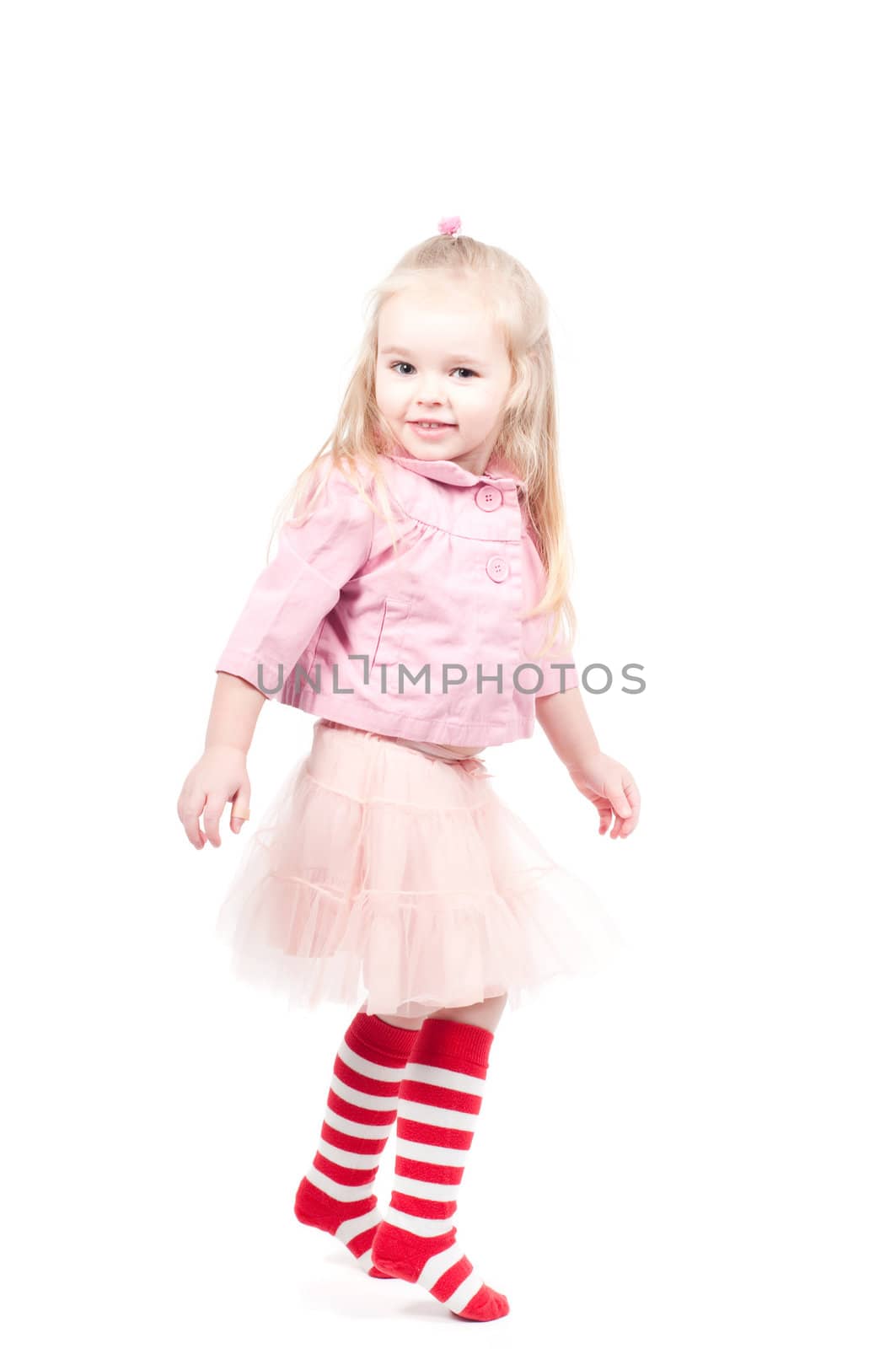 Studio shot of little girl, positive, playing