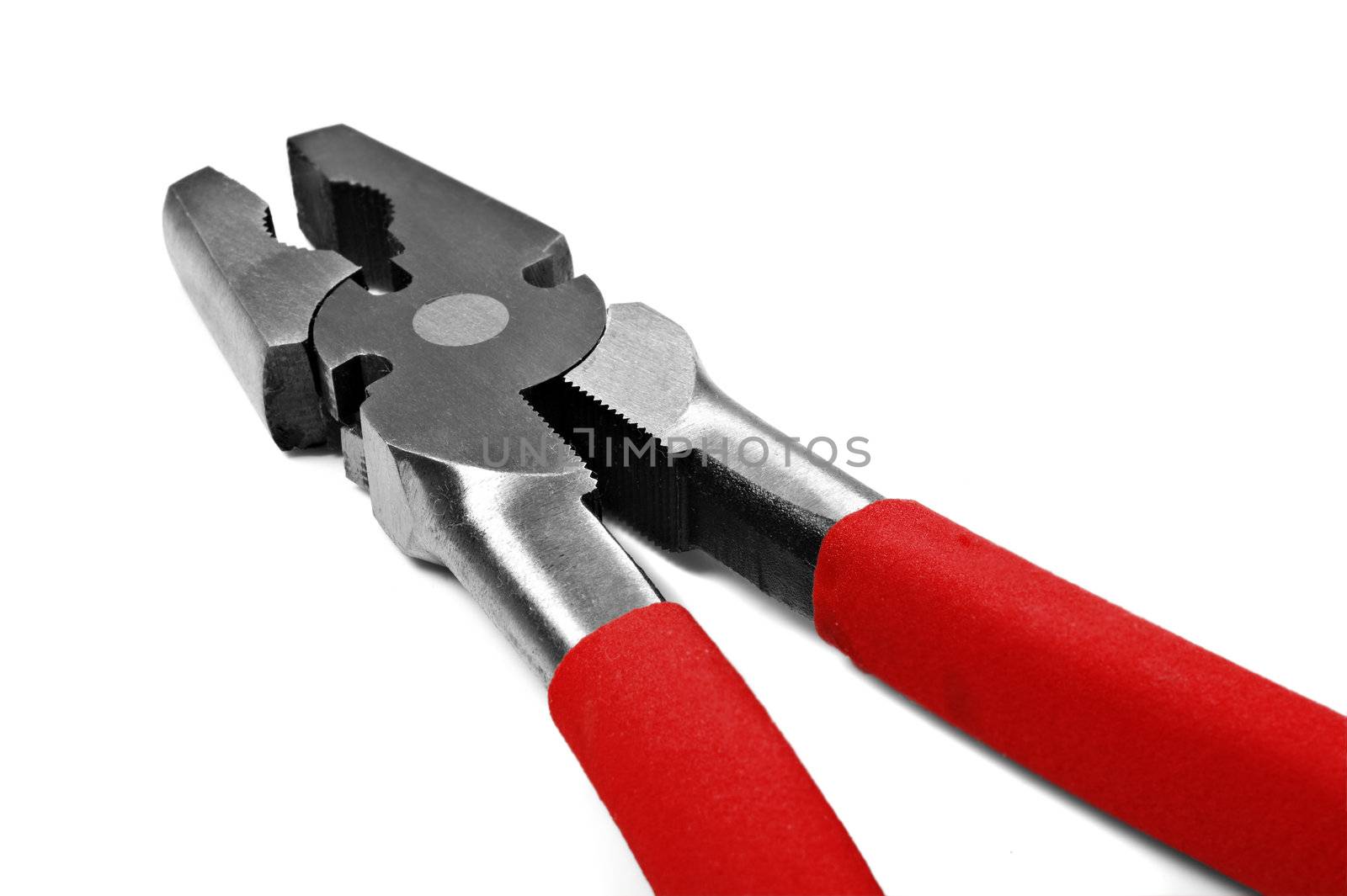 Close up macro of metal pliers on a white background with space for text