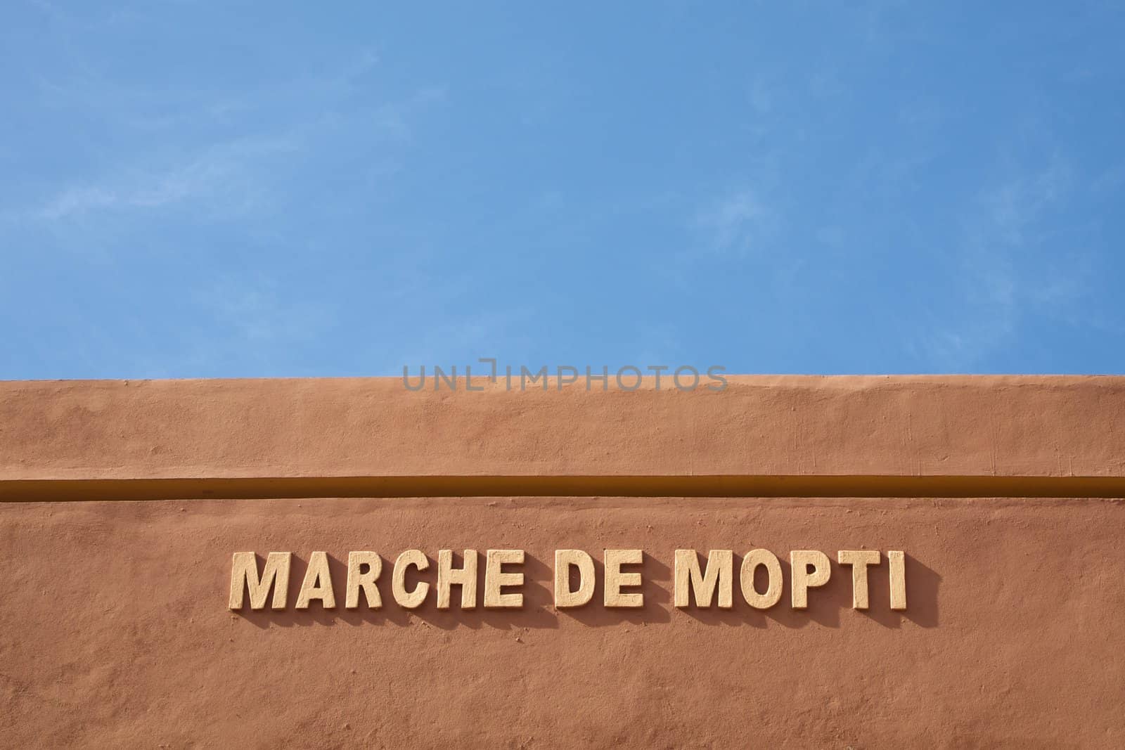 Entrance to the market of Mopti in Mali with a blue sky