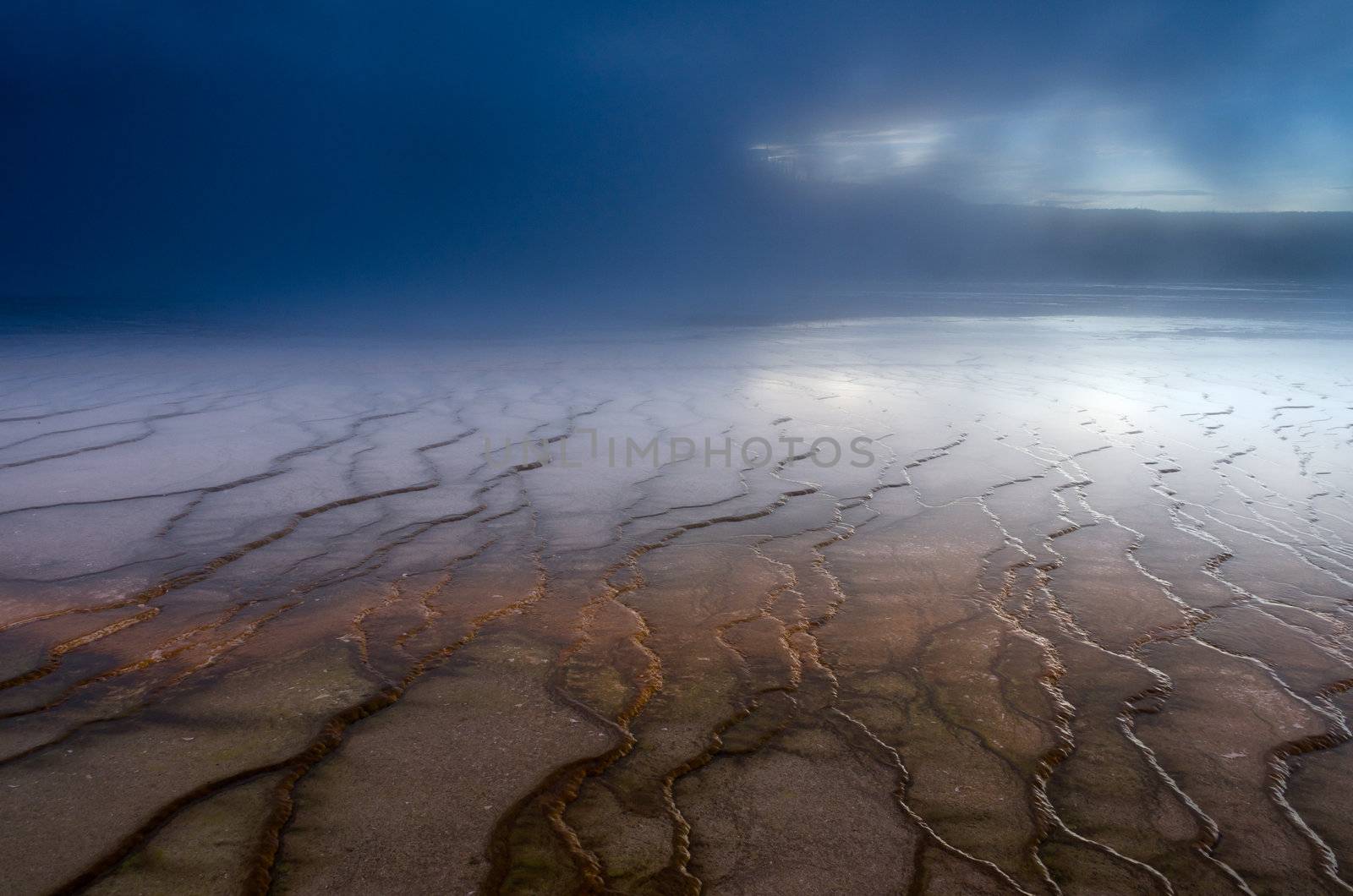 Geyserite patterns and steam from Grand Prismatic Spring, Yellowstone National Park, Wyoming, USA by CharlesBolin