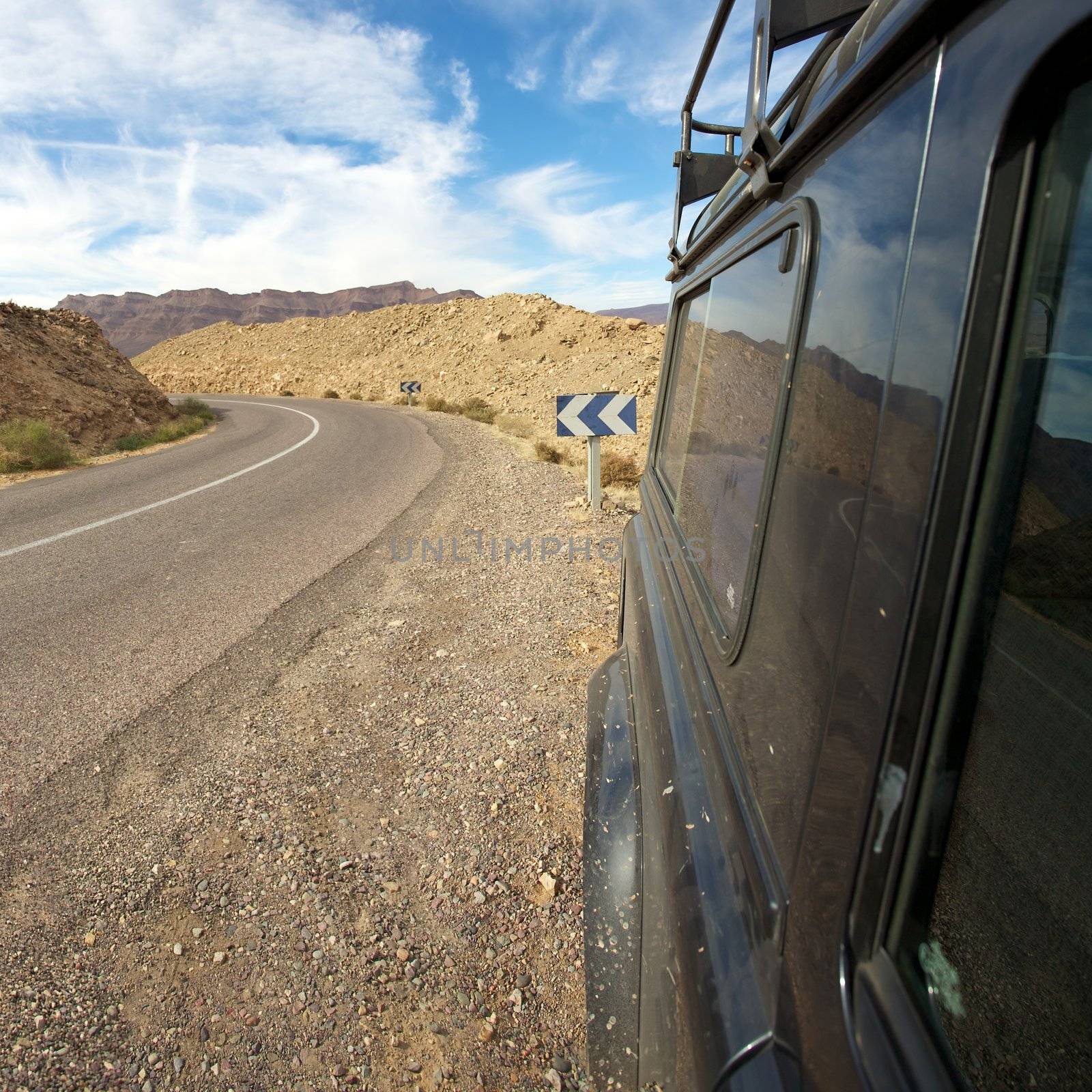 A four wheel drive car on a road in Morocco